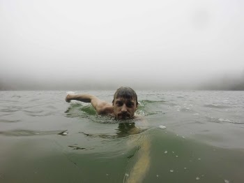 Man Taking a Photo of Her in the Ocean