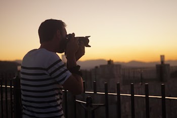 Man Taking a Photo Using a Dslr Camera