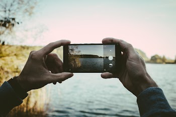 Man taking a picture with his cellphone 2