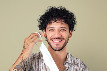 Man taking mask off during the new normal | Free stock photo | High Resolution image