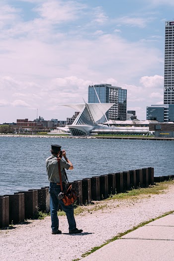 Man Taking Photo of Building