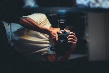 Man Taking Photo Of Himself 