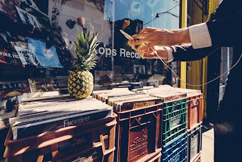 Man Taking Photo of the Pineapple