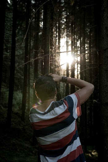 Man Taking Photo to the Forest