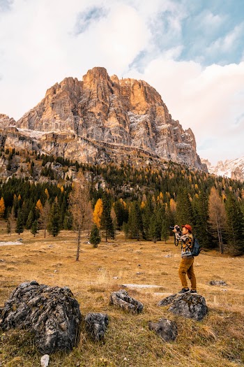Man Taking Photos Of A Scenery