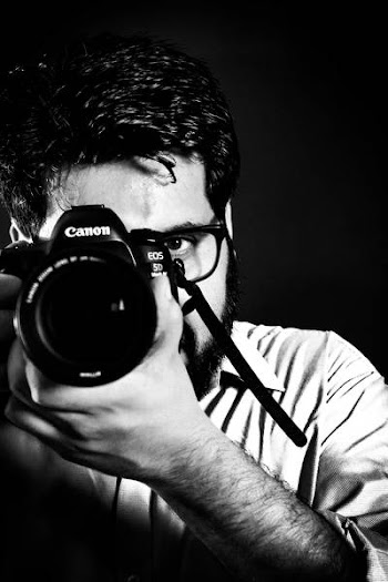 Man Taking Picture Front of Camea