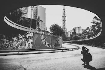 Man Taking Picture of Graffiti Wall