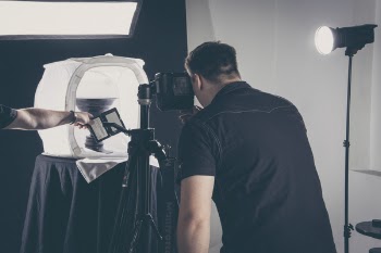 Man Taking Picture of Person's Left Arm