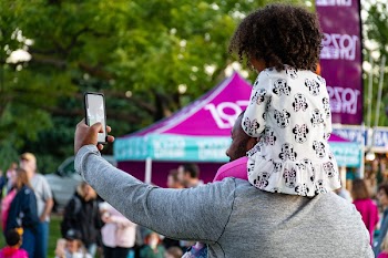 Man Taking Selfie With Girl Riding on Him