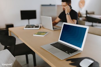 Man talking on a phone in a meeting room | Free stock psd mockup - 488431