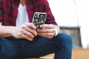 Man Texting iPhone Closeup