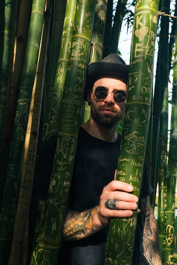 Man Through Bamboo Trees