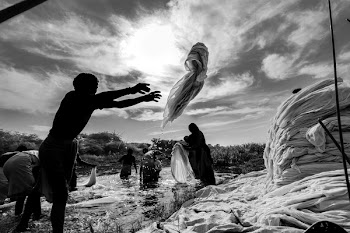 Man Throwing Garment