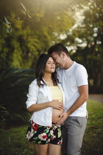 Man Touching Belly of Pregnant Woman