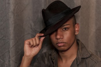 Man Touching His Black Fedora Hat
