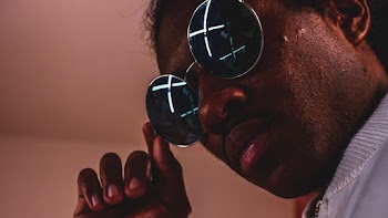 Man Touching His Sunglasses