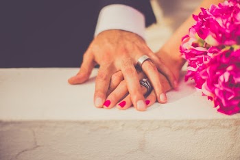 Man Touching Woman's Hand