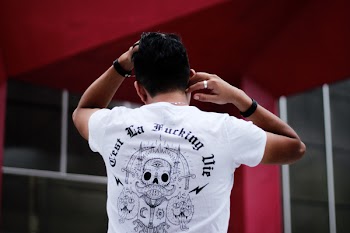 Man Turning Back Showing White T-shirt
