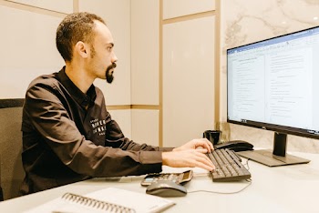 Man Typing on Computer Keyboard