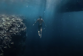Man Under Body Of Water