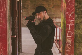 Man Using Airsoft Pistol