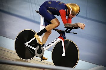 man using black and white women's Pinarello bicycle