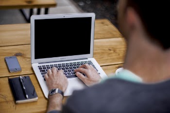 man using MacBook Air