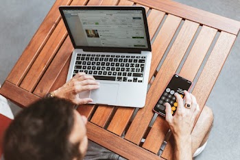 Man Using Macbook and Iphone X