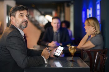 Man Using Smartphone in a Club