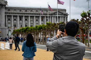 Man Using Smartphone to Capture Photo