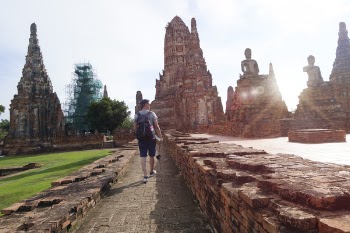 Man Walking Beside Ruins