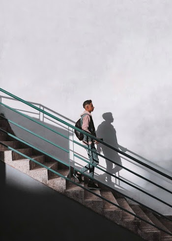 Man Walking Down The Stairs