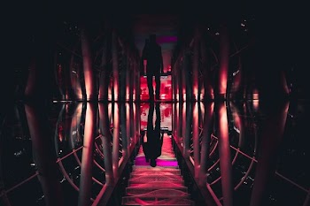 man walking in pathway