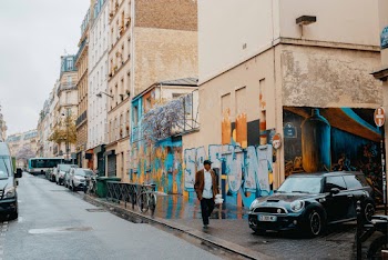 Man Walking Near Buildings