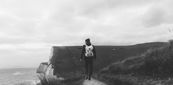 Man Walking Near Cliff