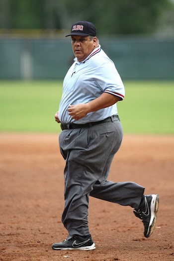 Man Walking Near Green Grass Field