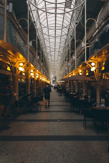 Man Walking Near Tables