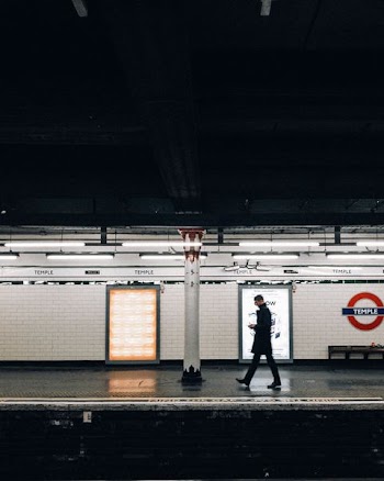 man walking near train
