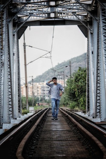 Man Walking on Bridge