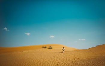 man walking on deser
