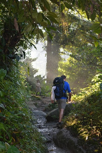 Man Walking on Muddy Trail