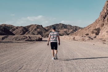 Man Walking on Road
