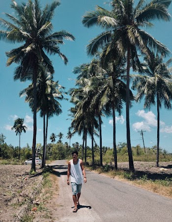 Man Walking on Road