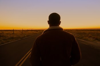 Man Walking on Road