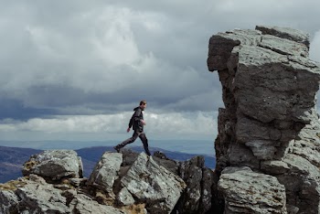 Man Walking on Rock Formations