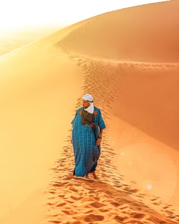 Man Walking On Sand