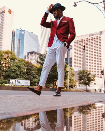 Man Walking on Sidewalk