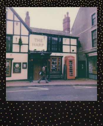 Man Walking on Sidewalk Beside Building