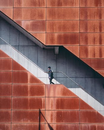 man walking on stairs at daytime