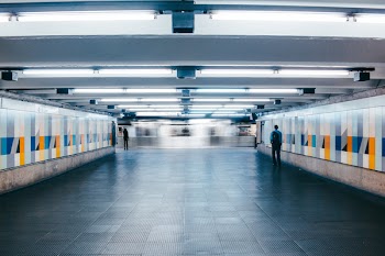 Man Walking on Subway Lobby